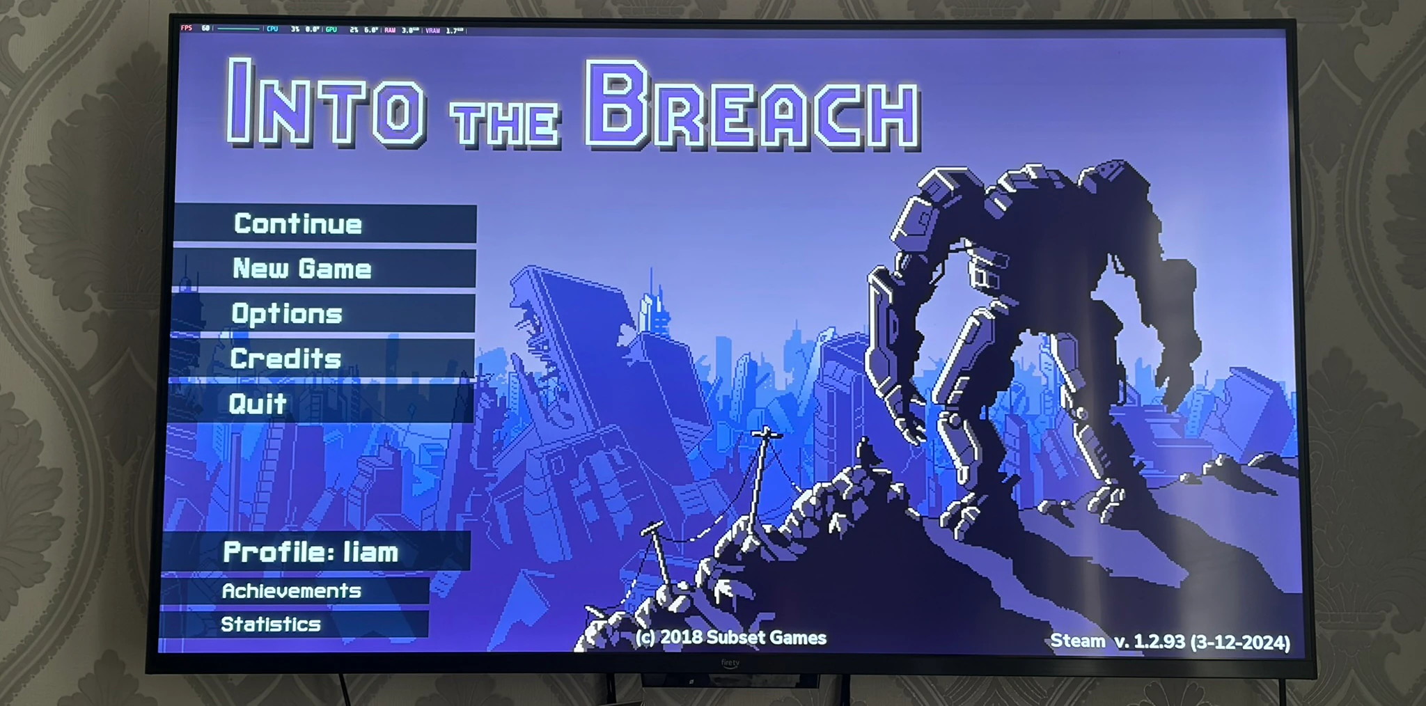 TV showing Into The Breach, with the SteamOS performance overlay at the top TV showing Into The Breach, with the SteamOS performance overlay at the top